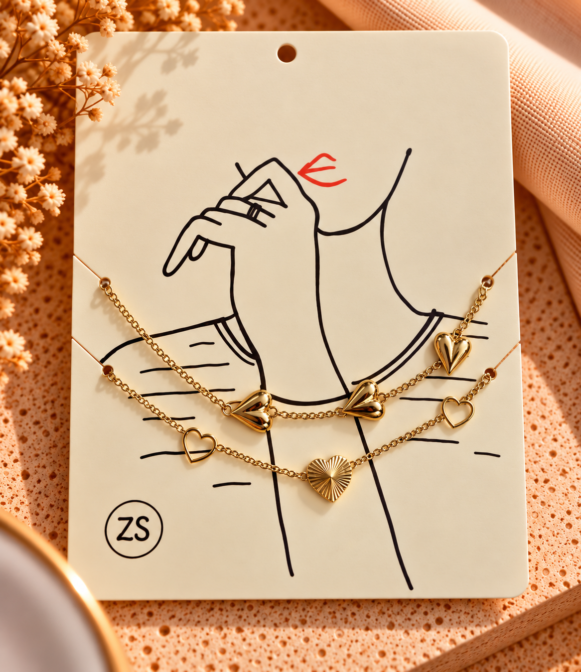 platte armband met hartjes goud/zilver