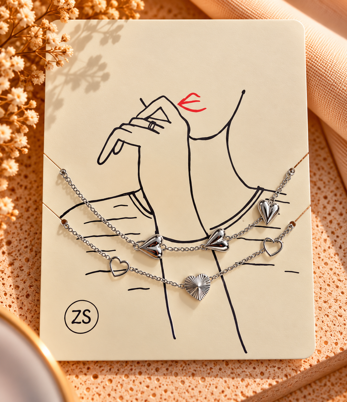 platte armband met hartjes goud/zilver
