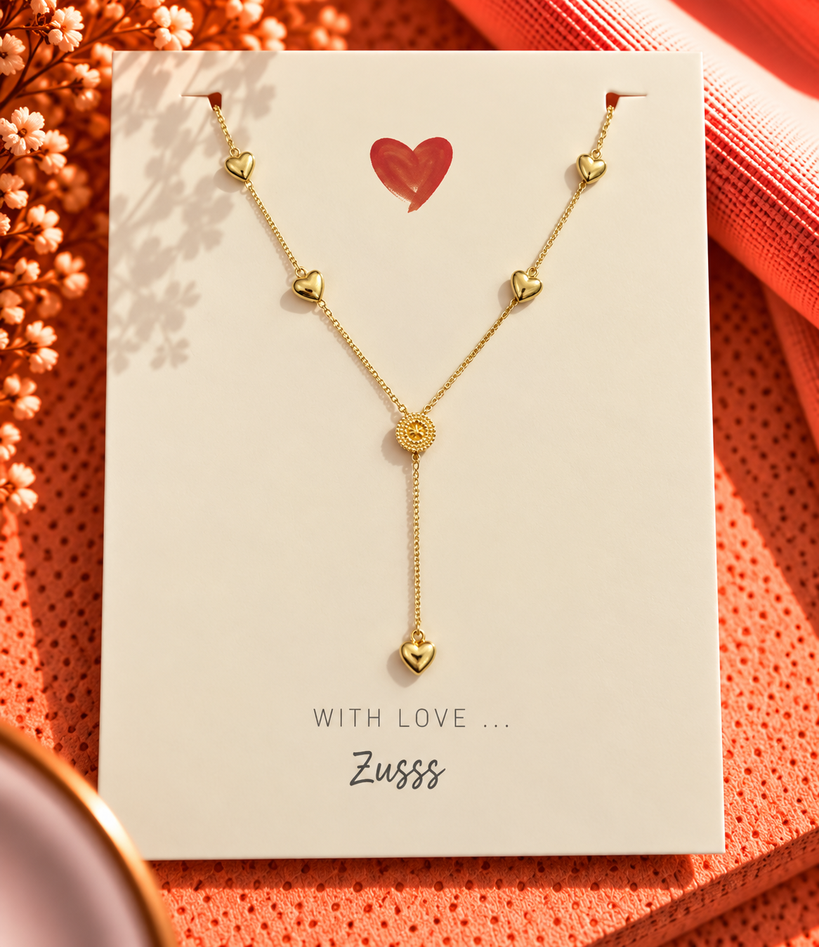 Ketting met bedel hartjes en muntjes